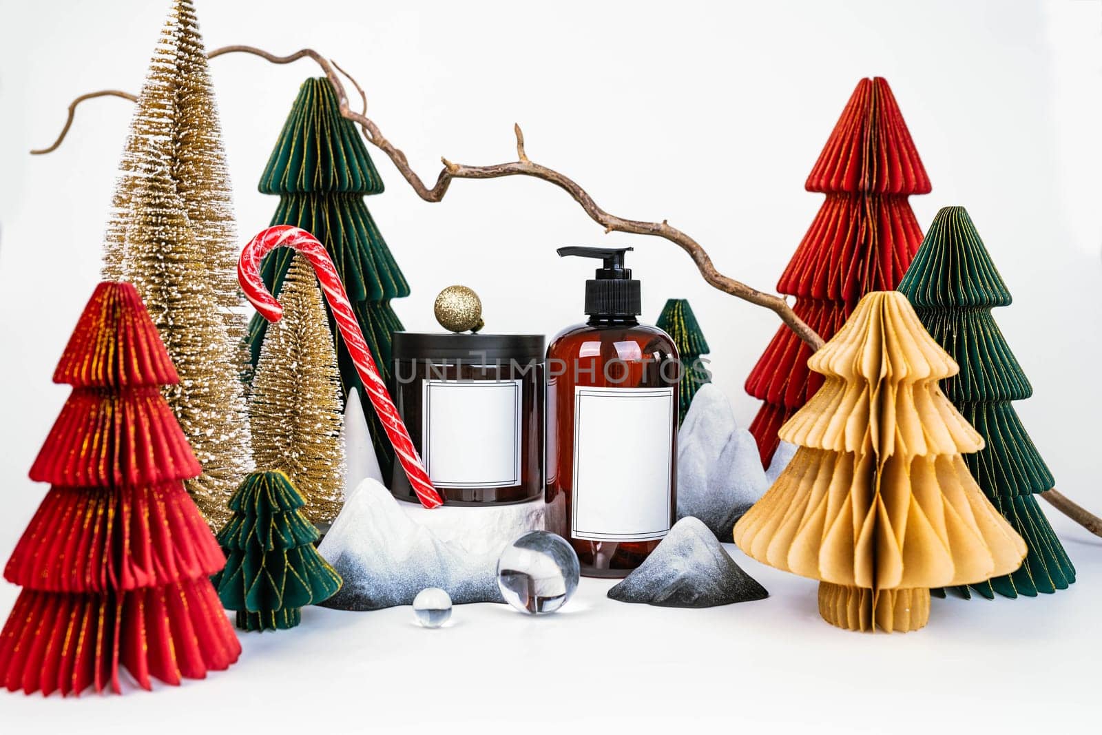 dark jar with lid and dispenser on the background of Christmas decorations, side view by tewolf