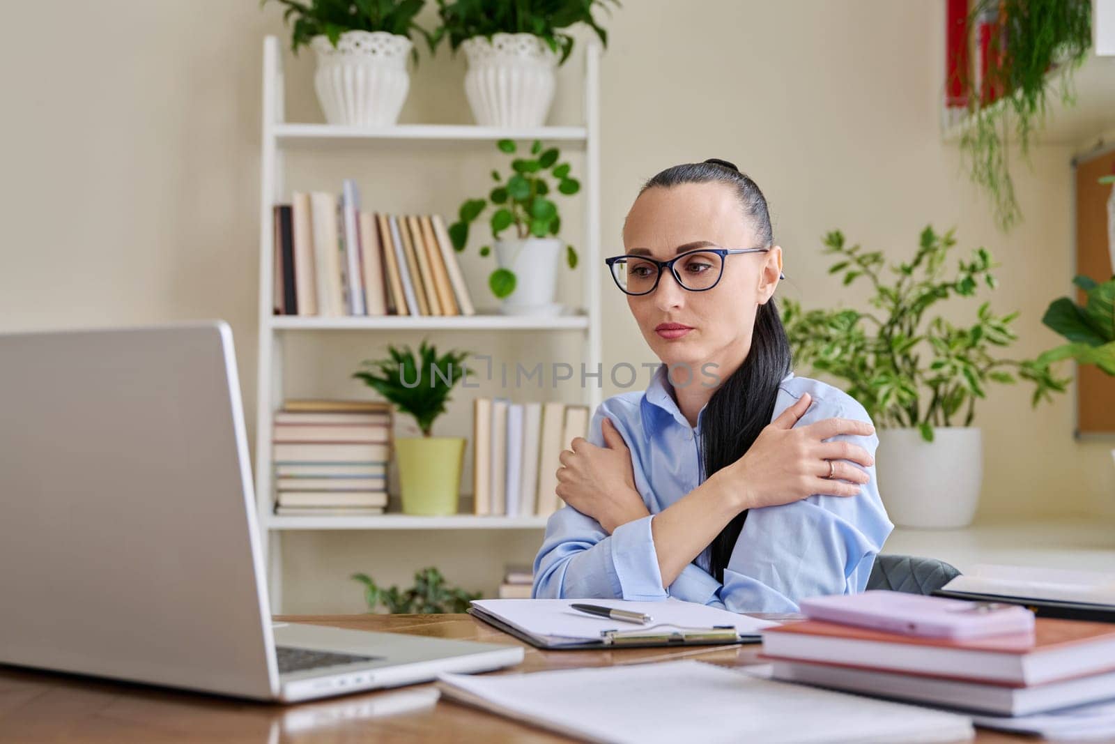 Female therapist psychologist showing breathing practice on laptop web cam technique that helps to quickly calm down restore peace of mind fall asleep faster relax. Psychology treatment mental support