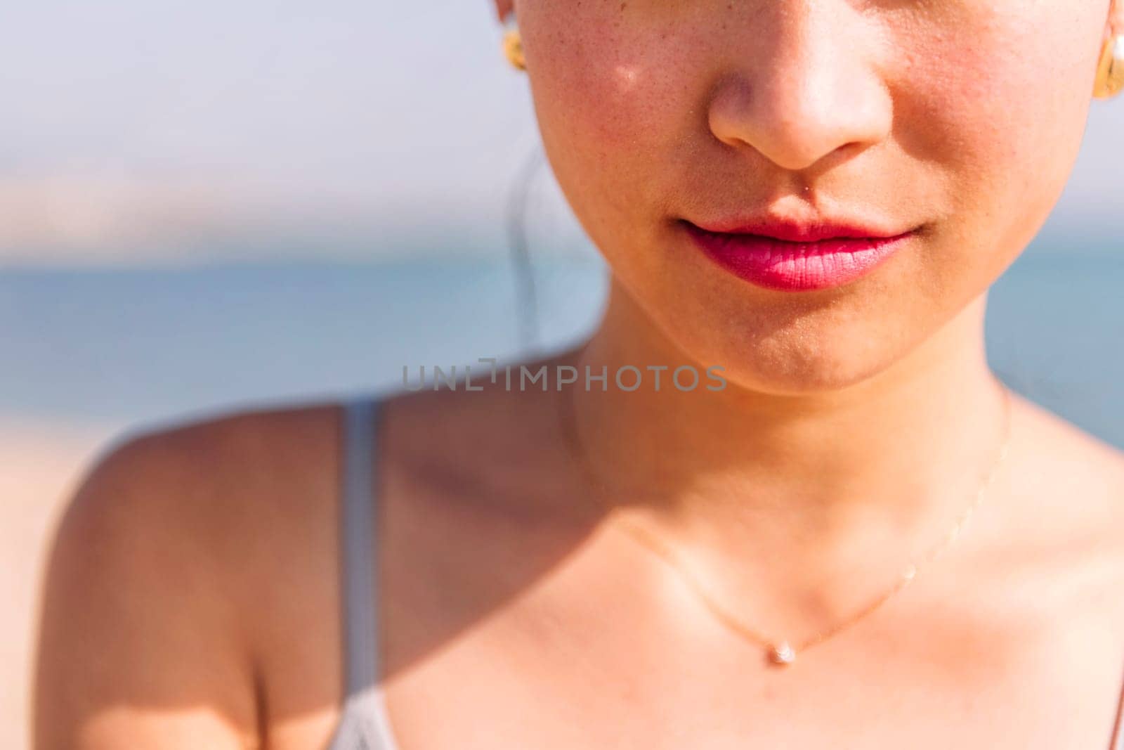close up of pretty mouth with closed lips of a young beautiful woman, concept of beauty and purity