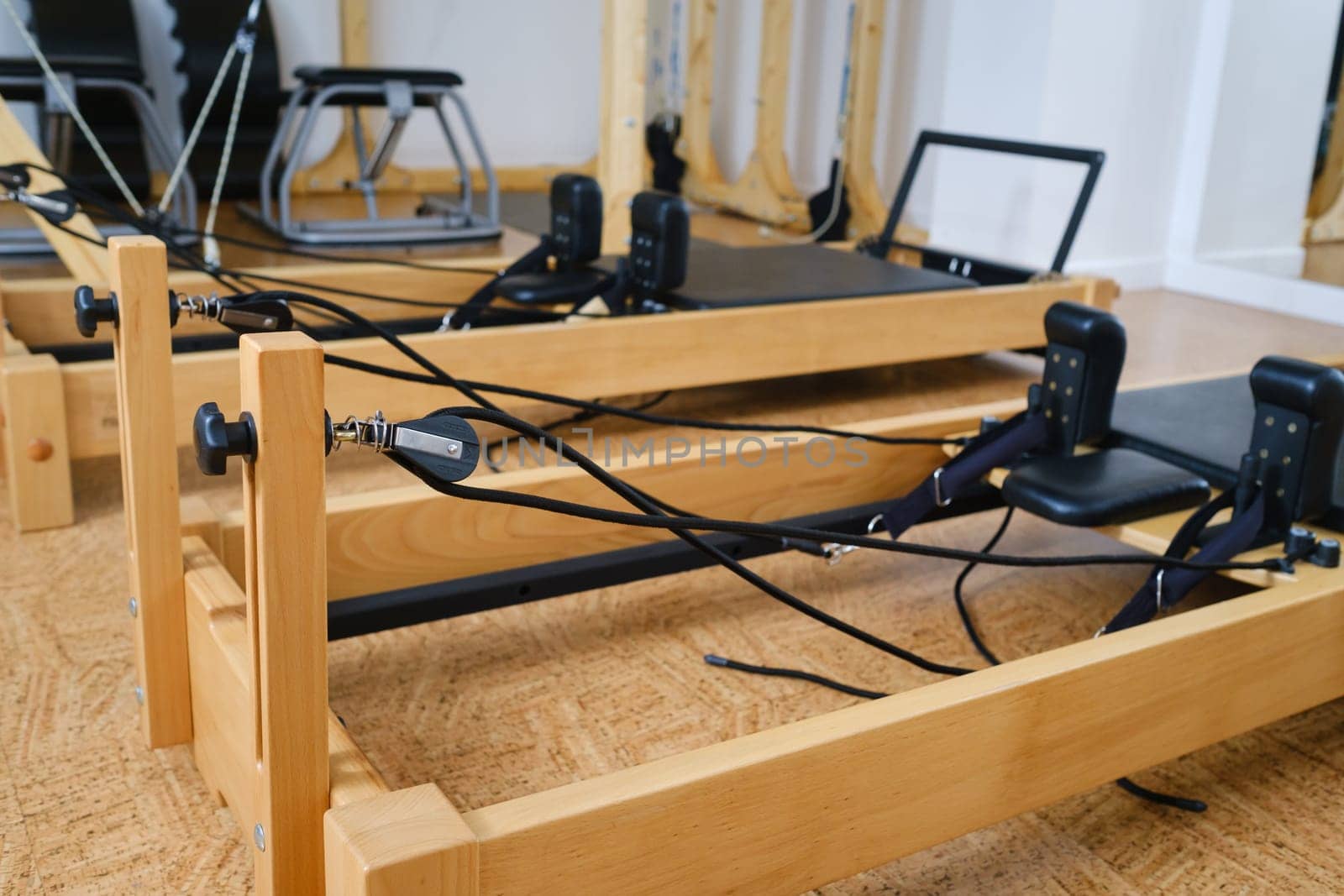 the reformer machine in the pilates room. Yoga equipment.