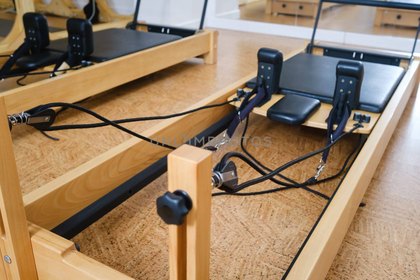 the reformer machine in the pilates room. Yoga equipment.