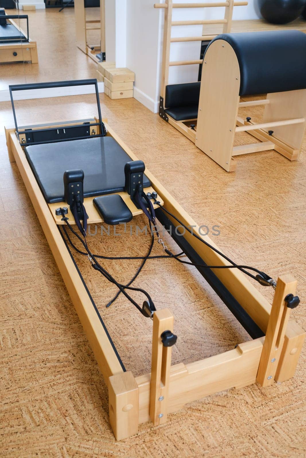 the reformer machine in the pilates room. Yoga equipment.