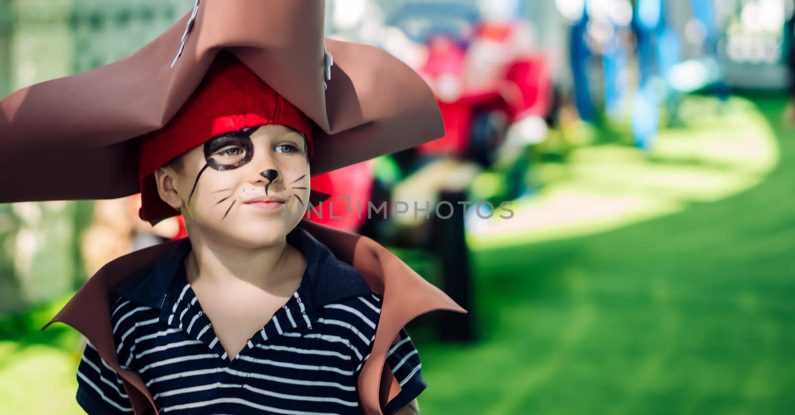 Boy Cat Pirate costume. Halloween party in kindergarten. Aqua makeup painted kids face. Bright festive by nandrey85