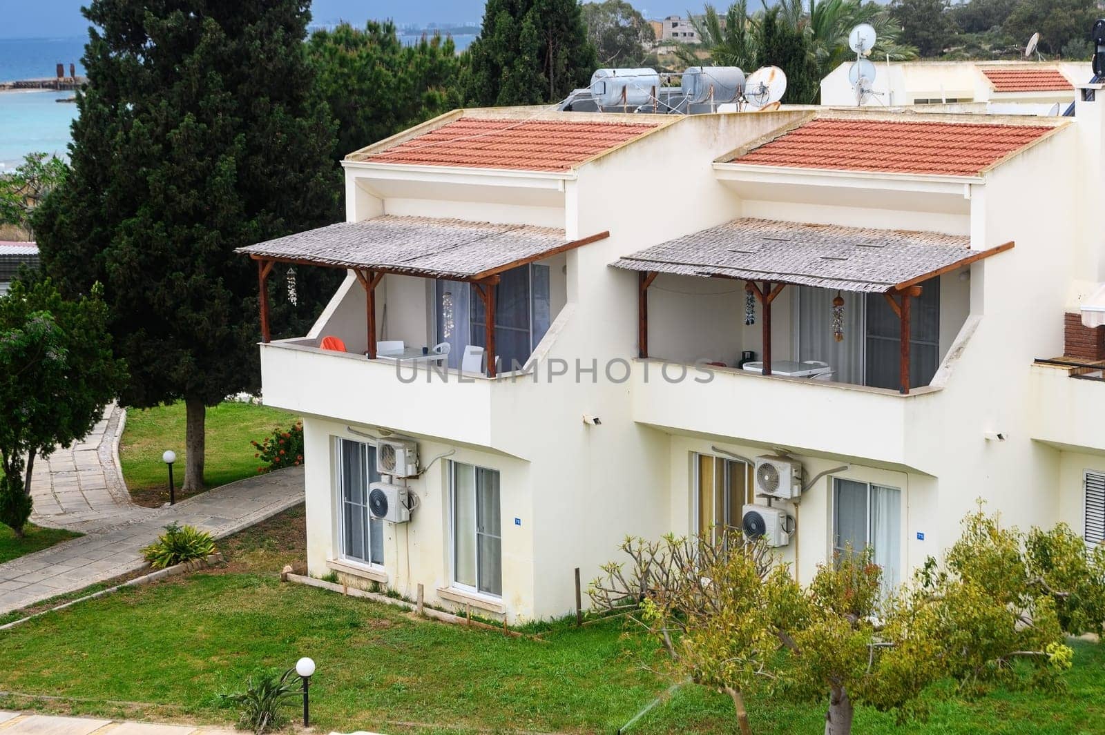 A solar powered and ecological water heater on a roof of a house by Mixa74