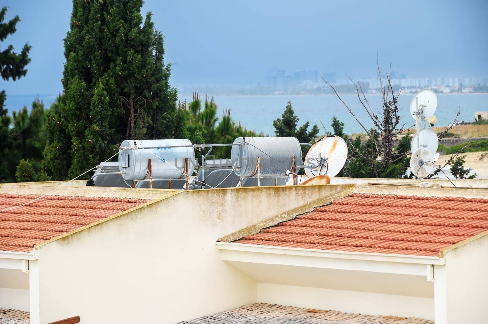 Solar boilers for water heating on the roofs of houses. Solar heated water. 1