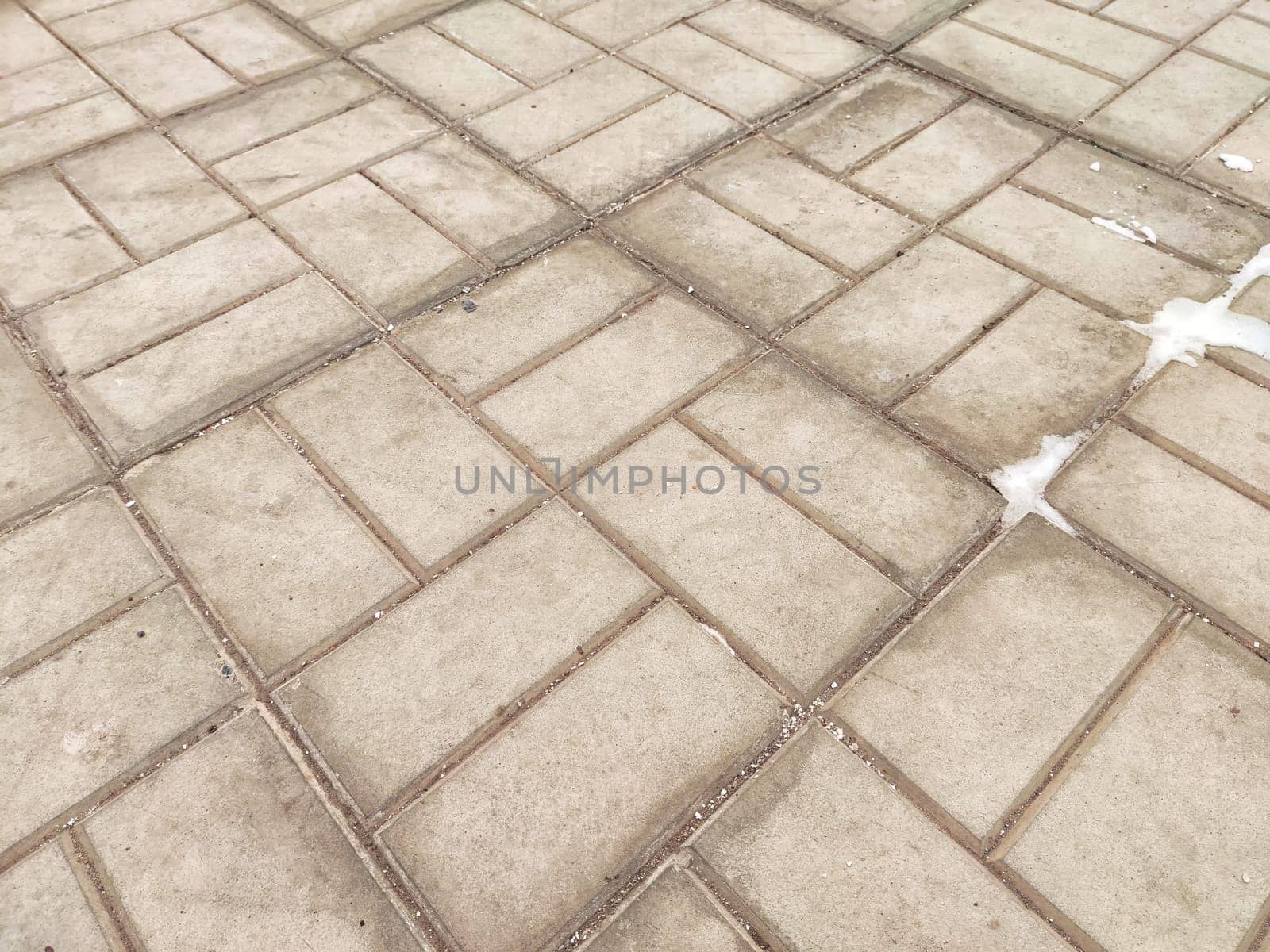 Worn tiles and snow on the ground. Background, texture, pattern, copy space