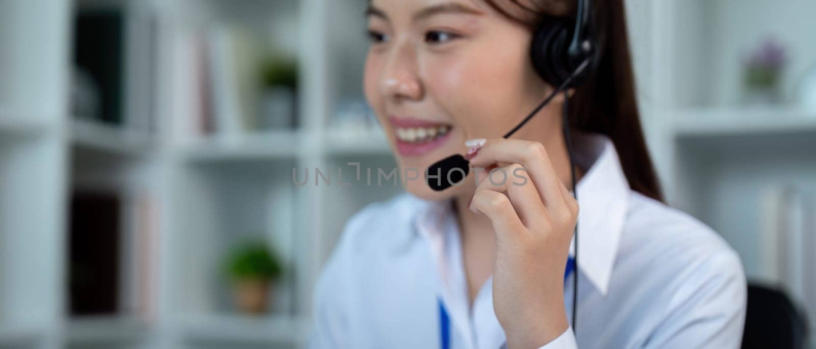 Call center woman asian in office for customer service, technical support and advice, contact and communication with employee operator in help desk agency.