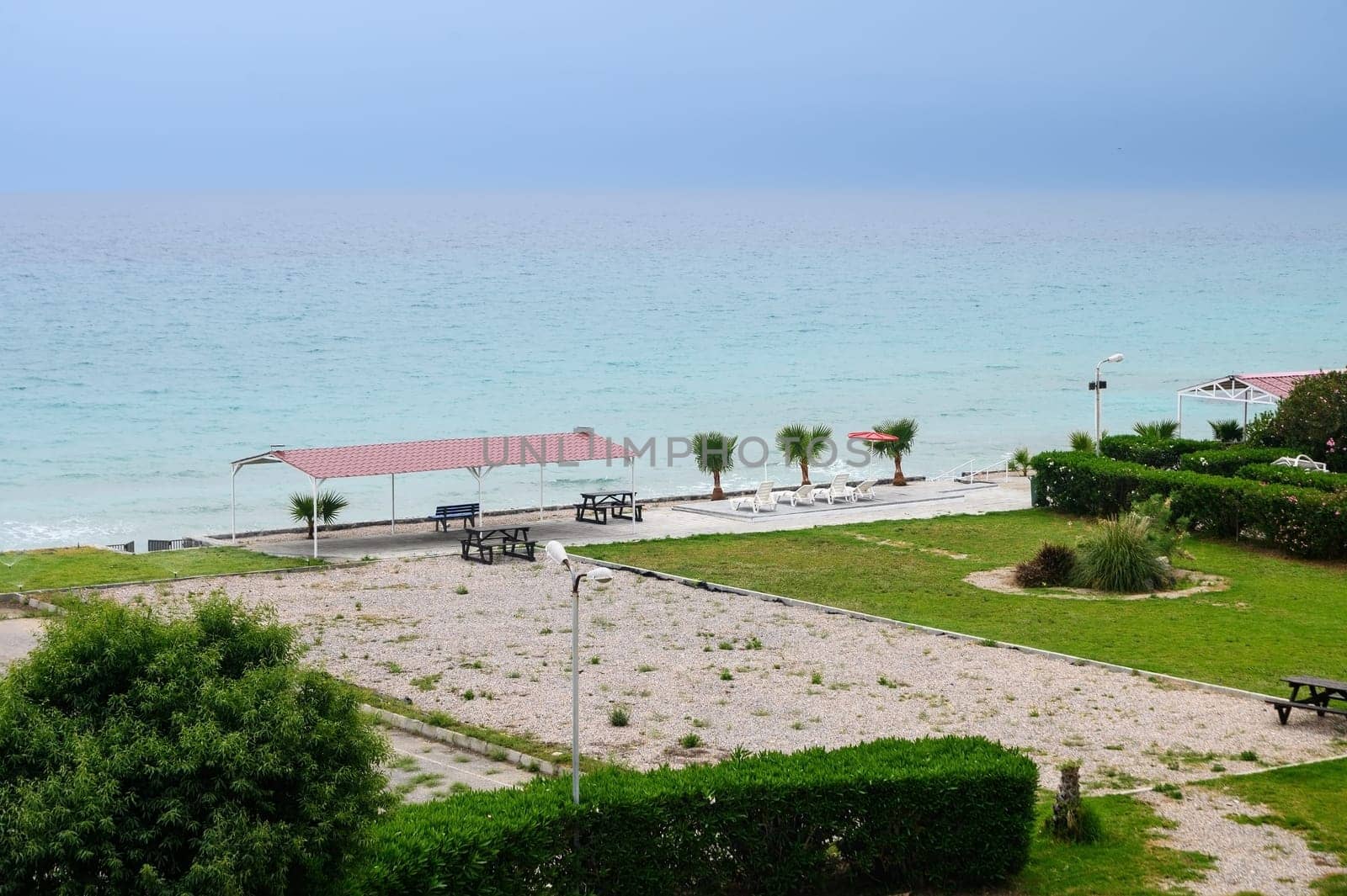 Beautiful beach. Chairs on the sandy beach near the sea.1