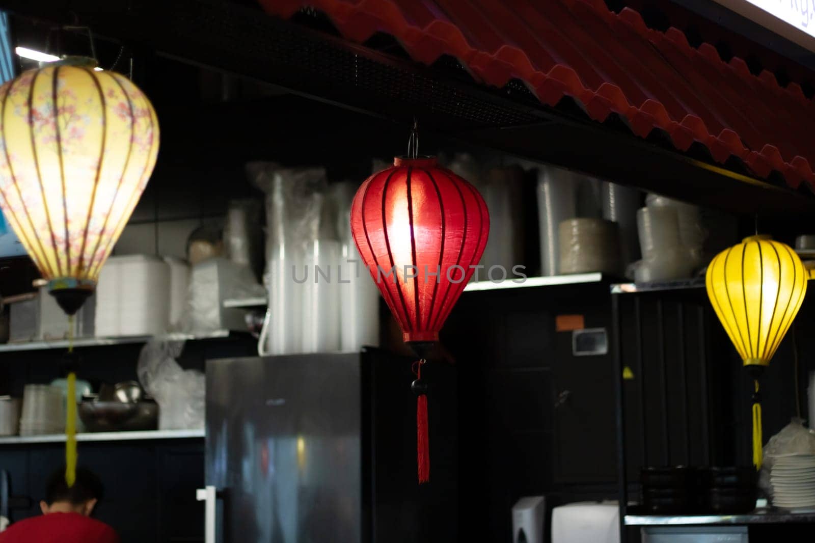 Colorful lanterns illuminate the restaurant, creating a vibrant atmosphere by Vera1703