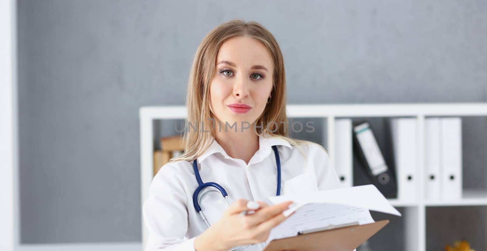 Beautiful smiling female doctor stand in office portrait. Physical and patient disease prevention exam er ward round 911 prescribe remedy healthy lifestyle consultant nurse profession concept