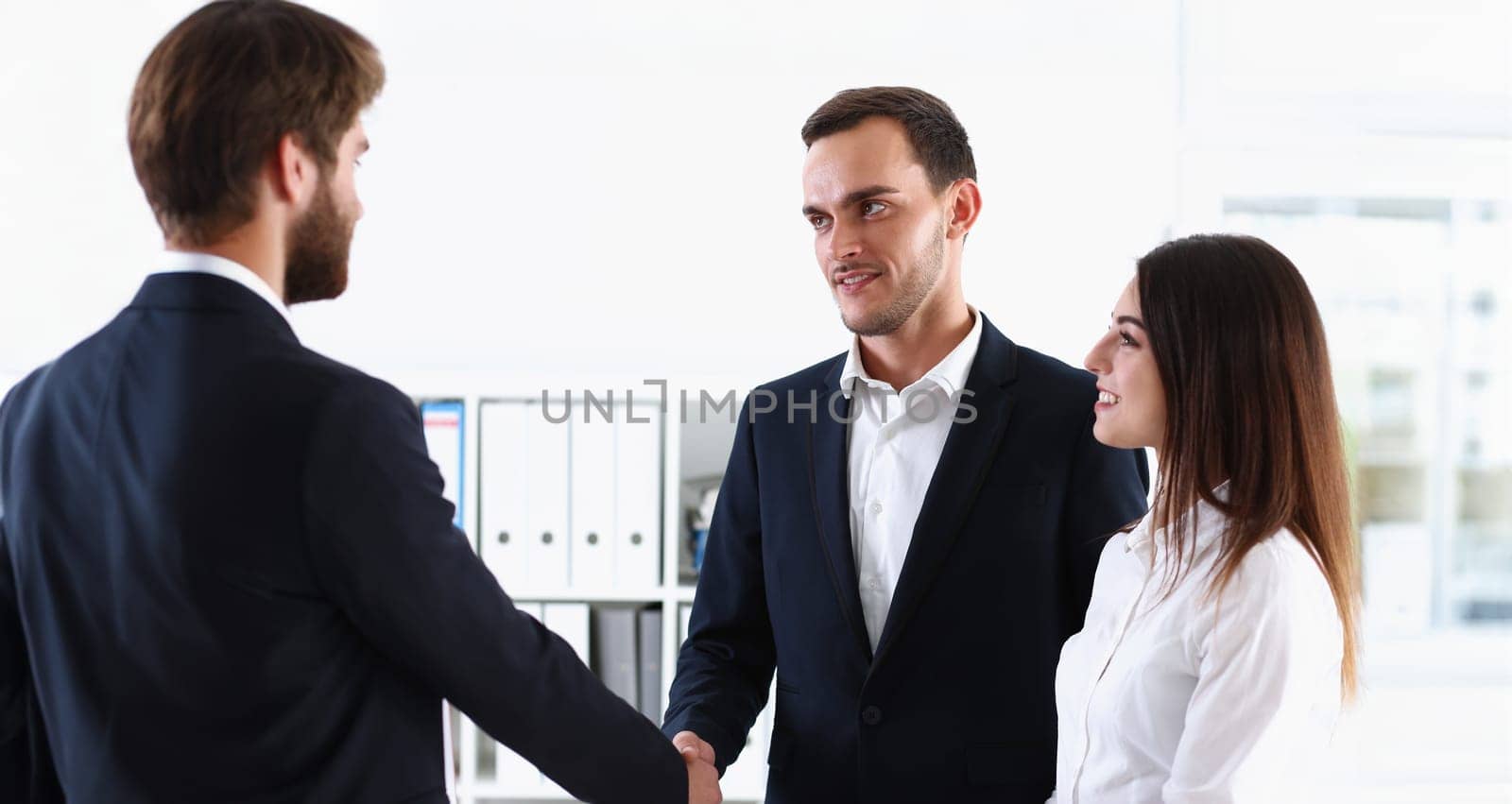 Escort service interpreter works with the transaction accompanies documents conclusion of the contract important situation. Arab businessman and his translator welcome business partner and says hello