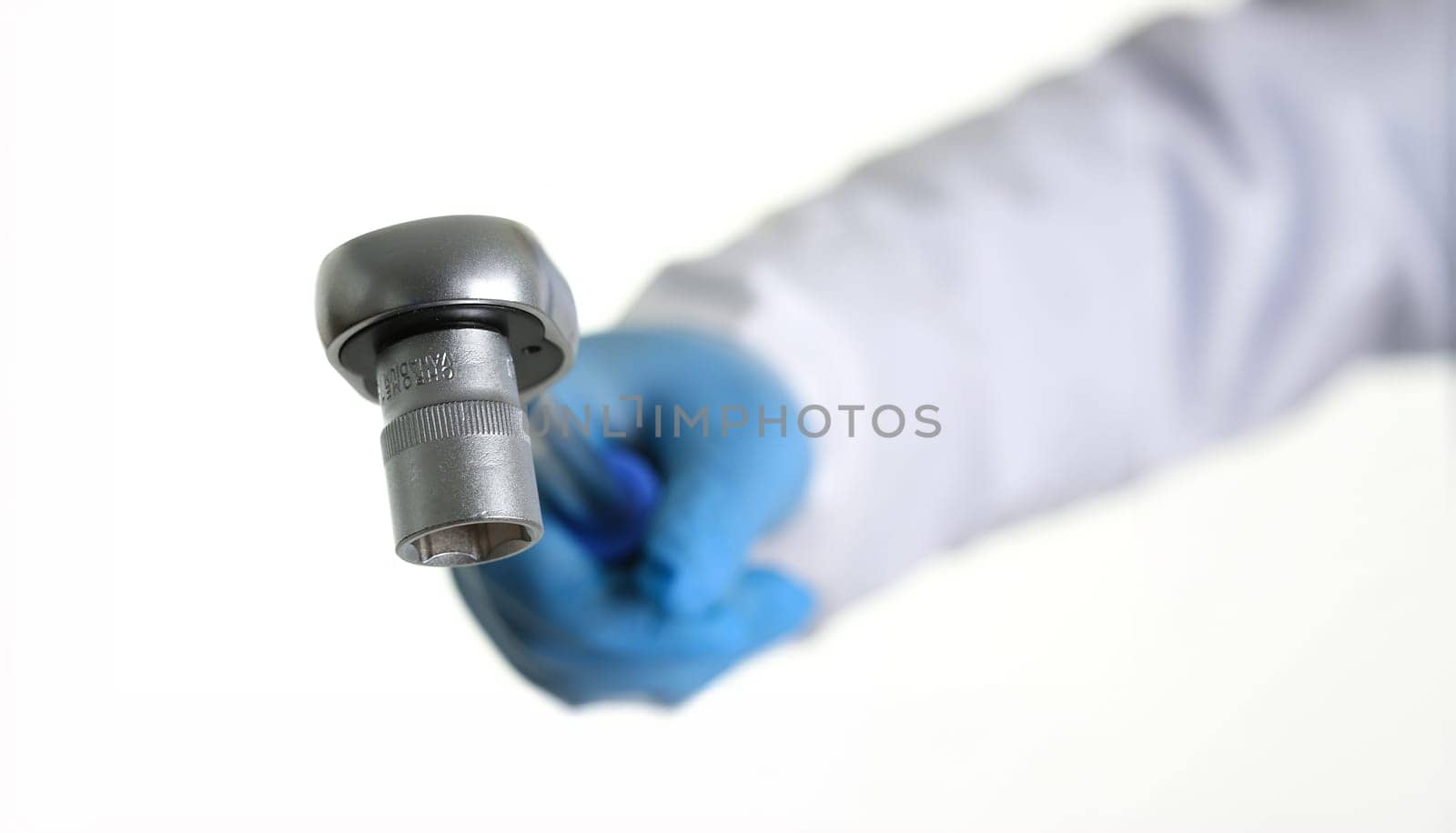 The key for the car repair man holding in his hand. Isolated on white.