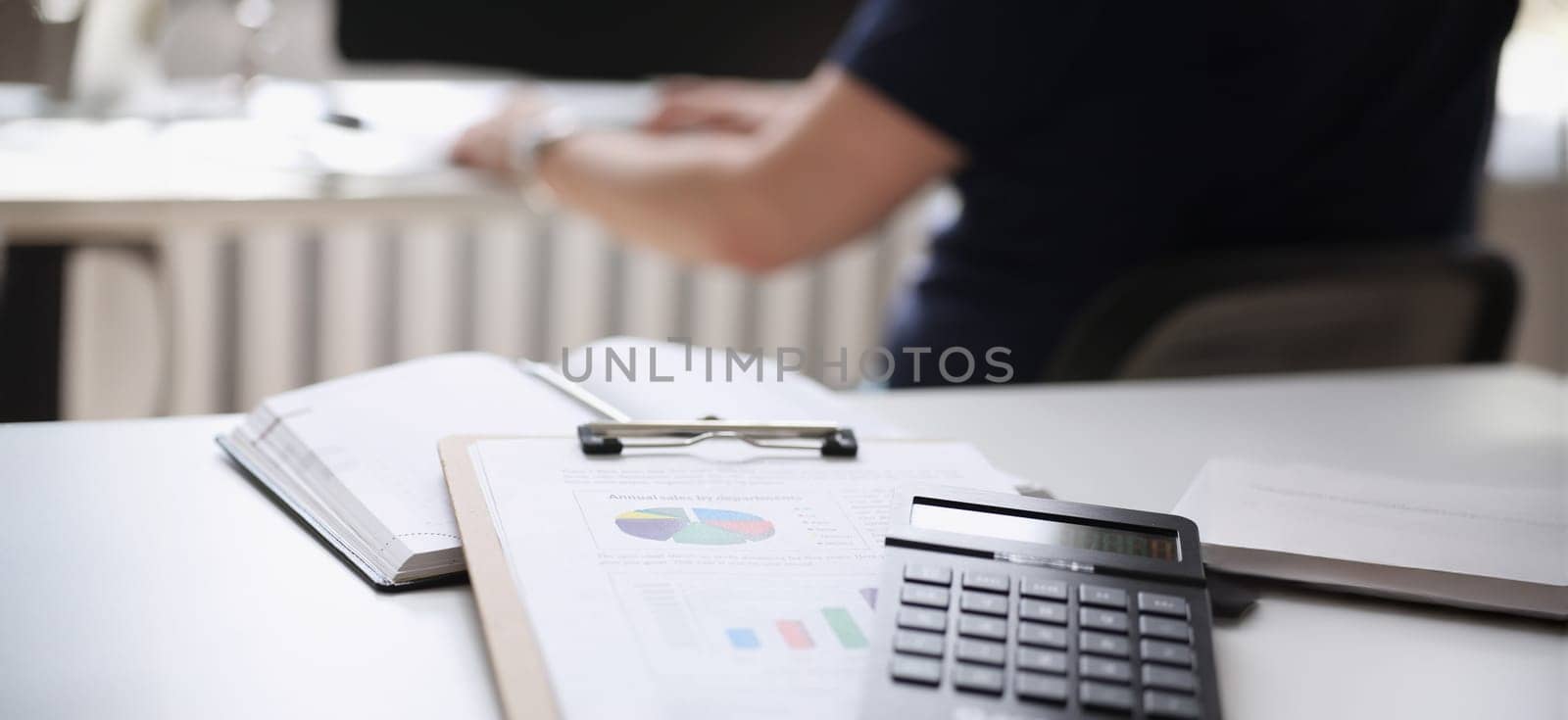 calculator paper document notebook lie on table office