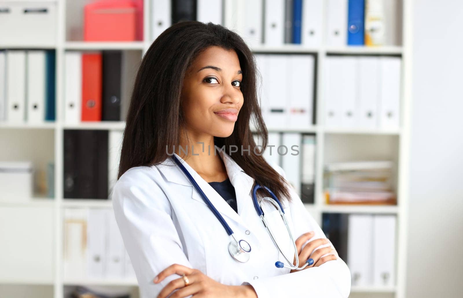 Beautiful black smiling female doctor portrait. Medic shop or store physical disease prevention er consultant 911 pulse measure healthy lifestyle concept