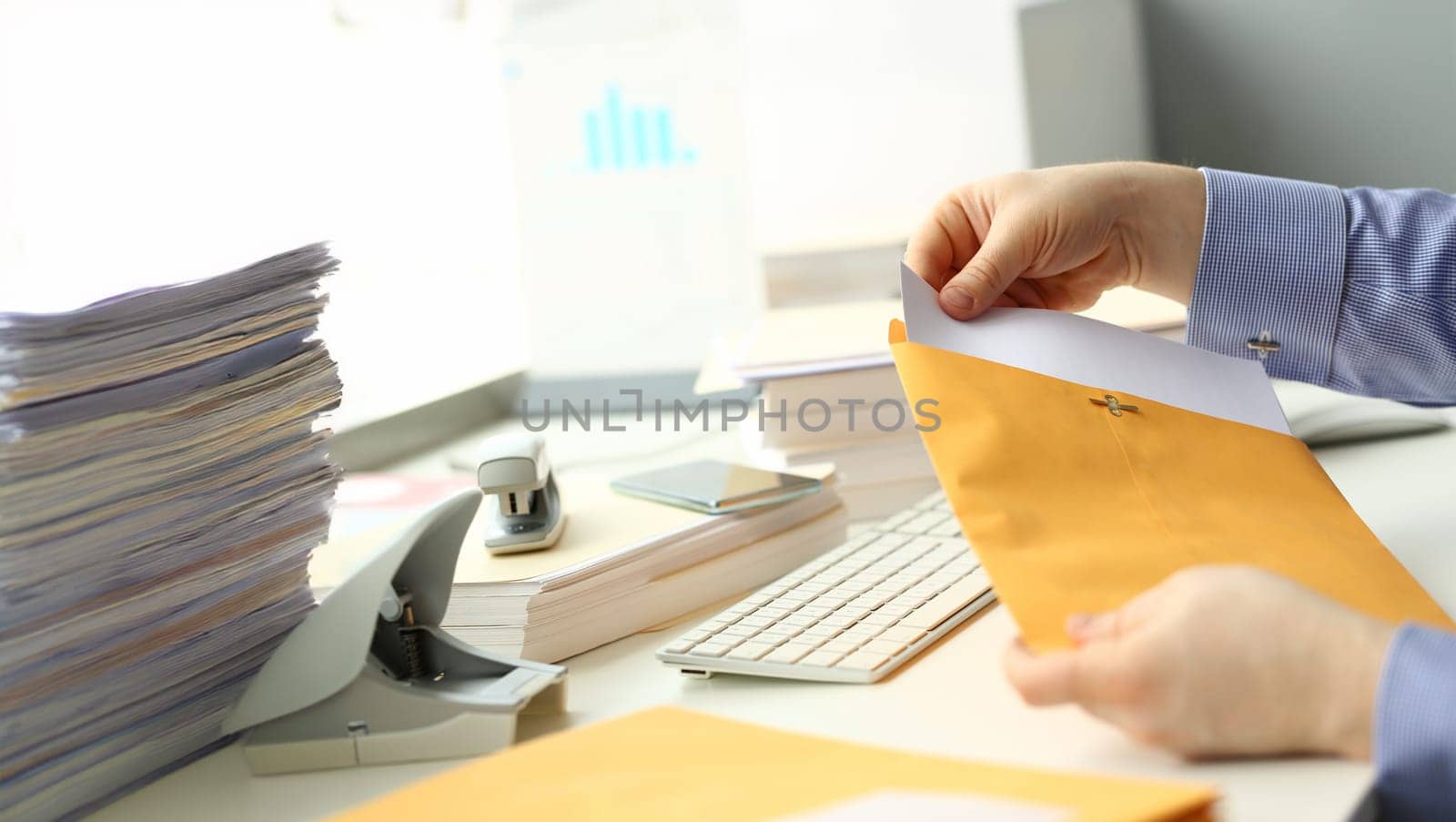 Businessman hold hand yellow mail envelope by kuprevich