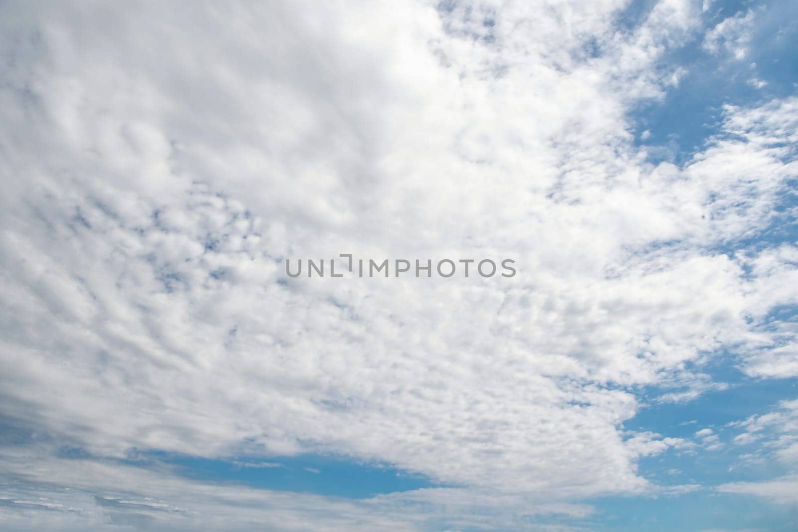 Sky is blue and cloudy. The clouds are white and fluffy by actionphoto50