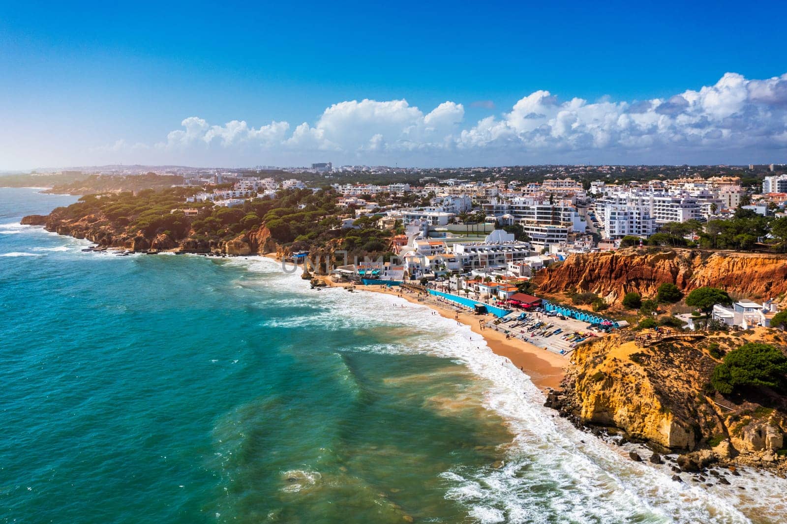 Amazing view from the sky of town Olhos de Agua in Albufeira, Algarve, Portugal. Aerial coastal view of town Olhos de Agua, Albufeira area, Algarve, Portugal.