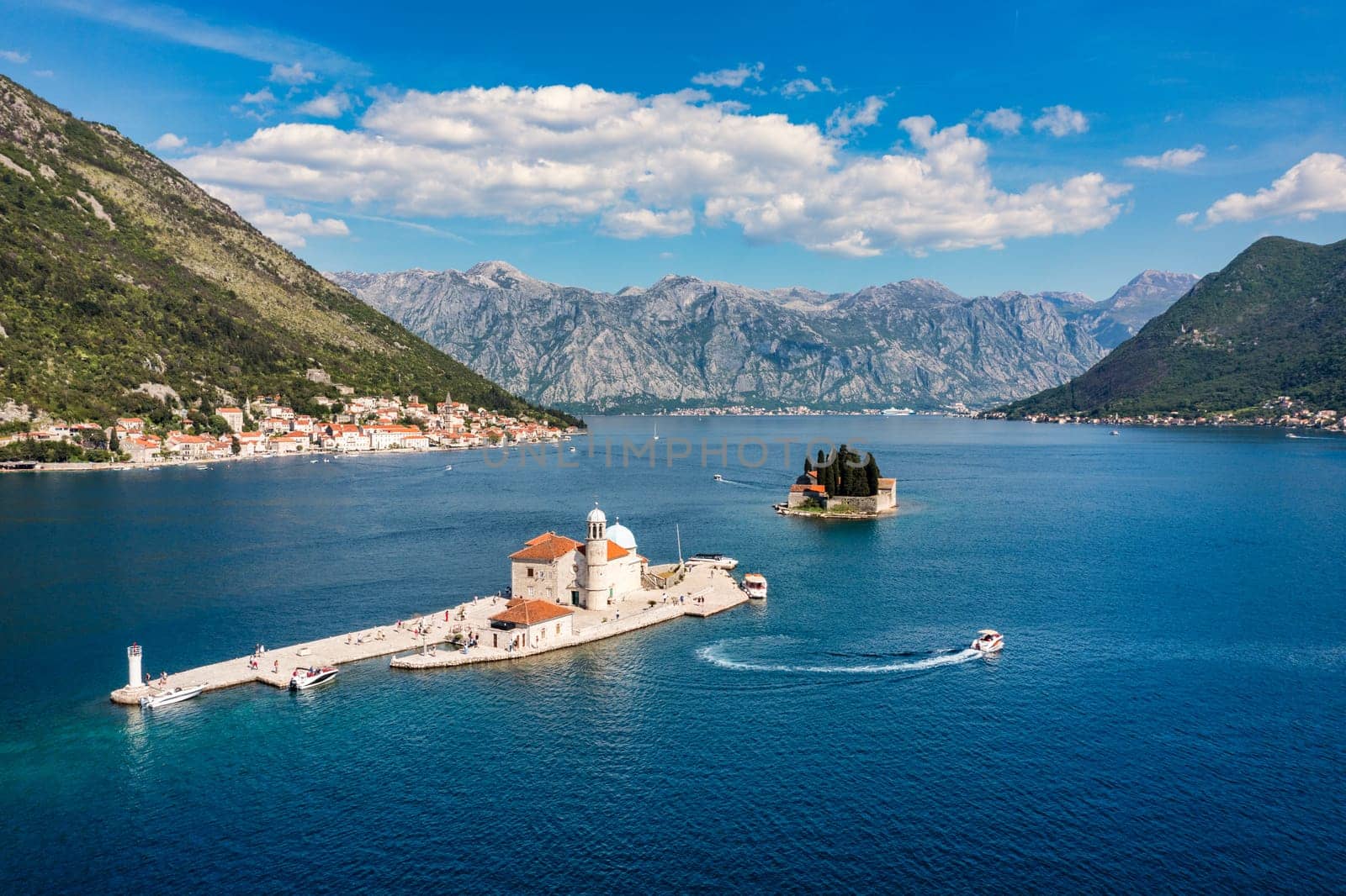 Saint George Island and Church of Our Lady of the Rocks in Perast, Montenegro. Our Lady of the Rock island and Church in Perast on shore of Boka Kotor bay (Boka Kotorska), Montenegro, Europe. 