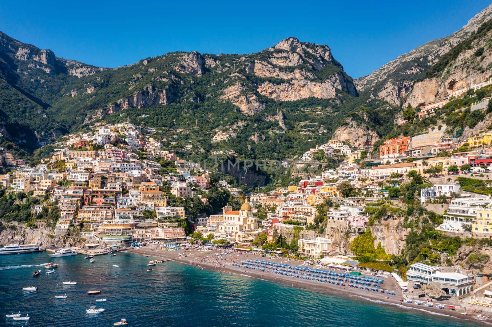 Aerial view of Positano with comfortable beach and blue sea on Amalfi Coast in Campania, Italy. Positano village on the Amalfi Coast, Salerno, Campania. Beautiful Positano, Amalfi Coast in Campania.