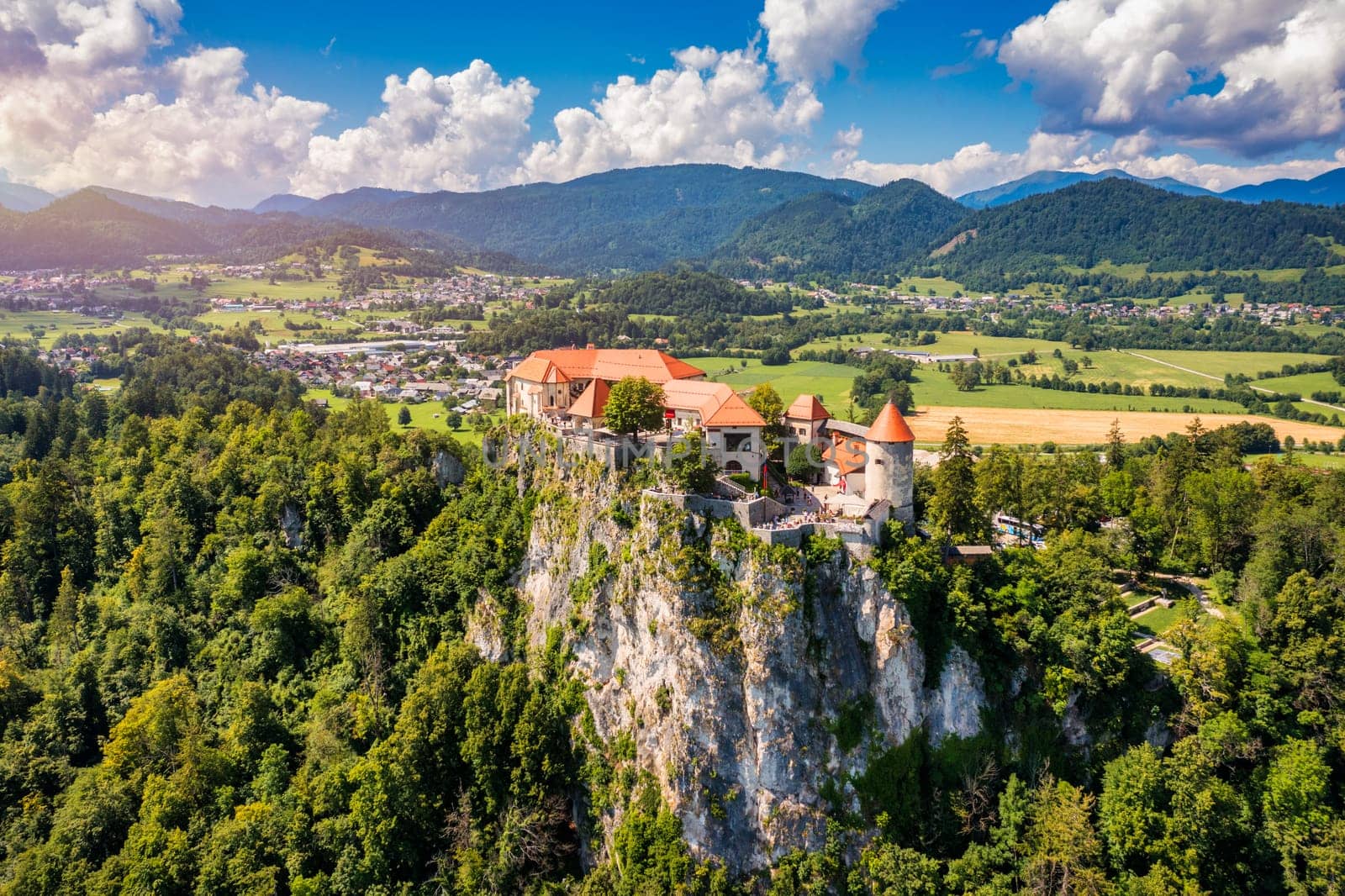Bled, Slovenia, aerial view of beautiful Bled Castle (Blejski Grad) with Lake Bled (Blejsko Jezero), the Church of the Assumption of Maria on a bright summer day. Bled, Slovenia.