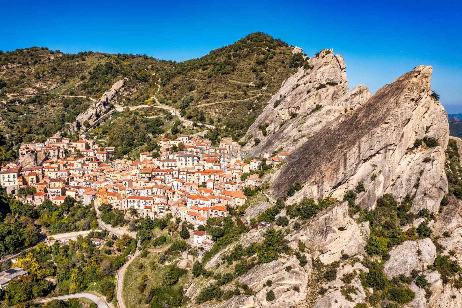 The picturesque village of Castelmezzano, province of Potenza, Basilicata, Italy. Cityscape aerial view of medieval city of Castelmazzano, Italy. Castelmezzano village in Apennines Dolomiti Lucane.