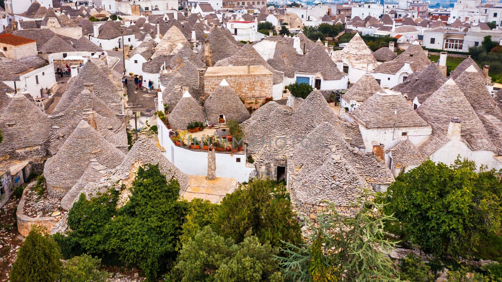 The traditional Trulli houses in Alberobello city, Apulia, Italy. Cityscape over the traditional roofs of the Trulli, original and old houses of this region, Apulia, Alberobello, Puglia, Italy. 