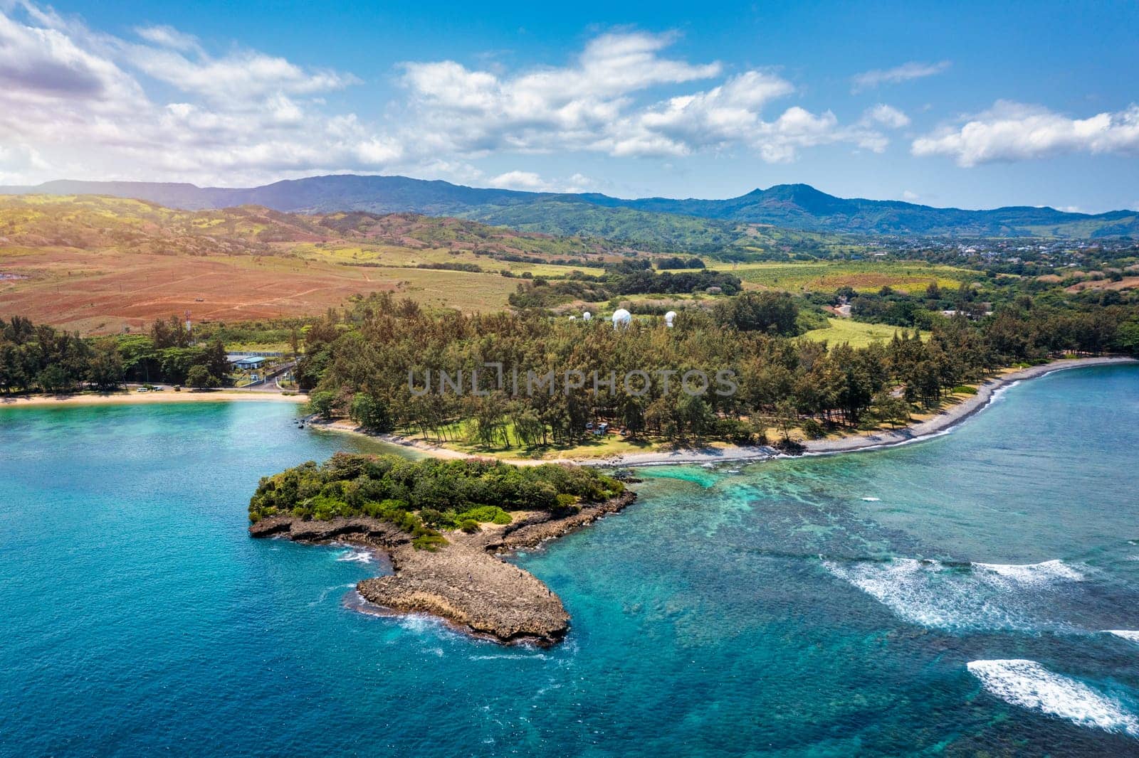 Aerial panoramic of waves of Indian Ocean and turquoise coral reef, Poste Lafayette, East coast, Mauritius. Turquoise coral reef meeting the waves of the Indian Ocean, Poste Lafayette, Mauritius.