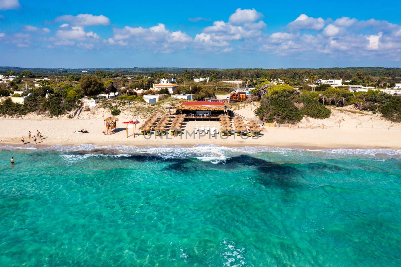 Punta Prosciutto azure sea water, crystal clear water on beach Punta Prosciutto, Italian Maldives Puglia Italy. Punta Prosciutto in Apulia, one of the most beautiful beaches of Italy.