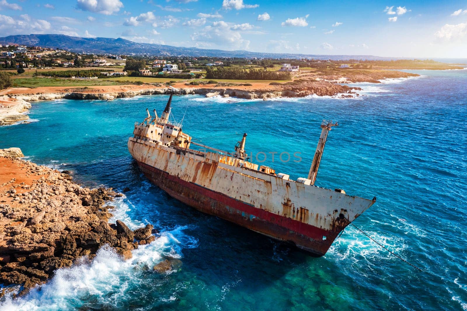 Abandoned Edro III Shipwreck at seashore of Peyia, near Paphos, Cyprus. Historic Edro III Shipwreck site on the shore of the water in Cyprus. Aerial view of Shipwreck EDRO III, Pegeia, Paphos.