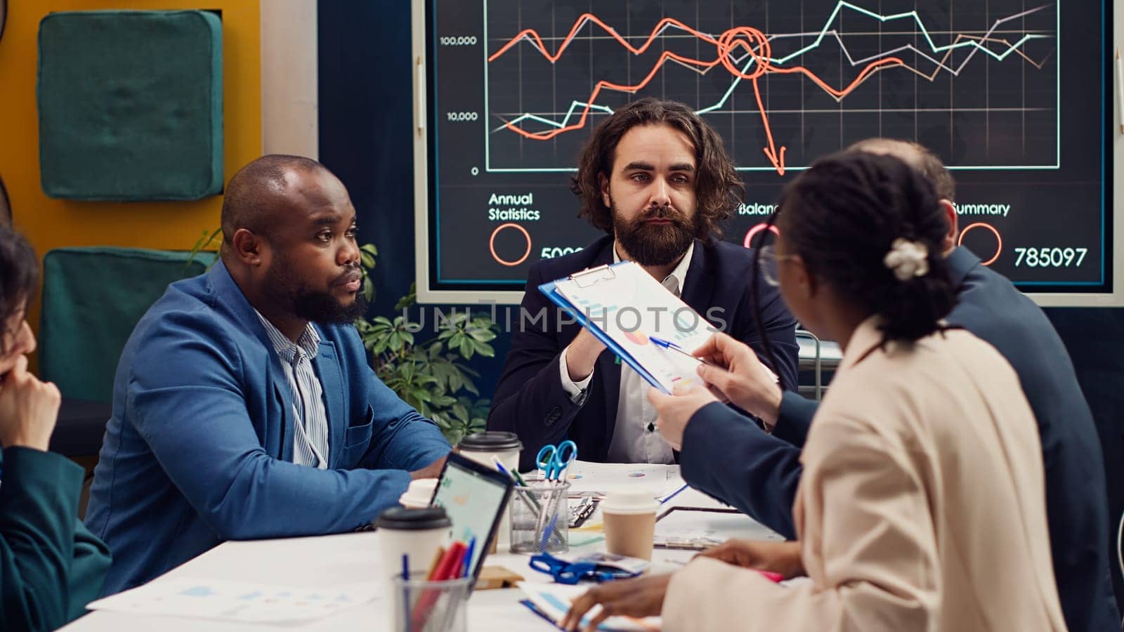 Business team trying to eliminate risks of unforeseen events and disruptions, discussing supply chain resilience and contingency planning. Diverse staff members accomplishing goals. Camera A.