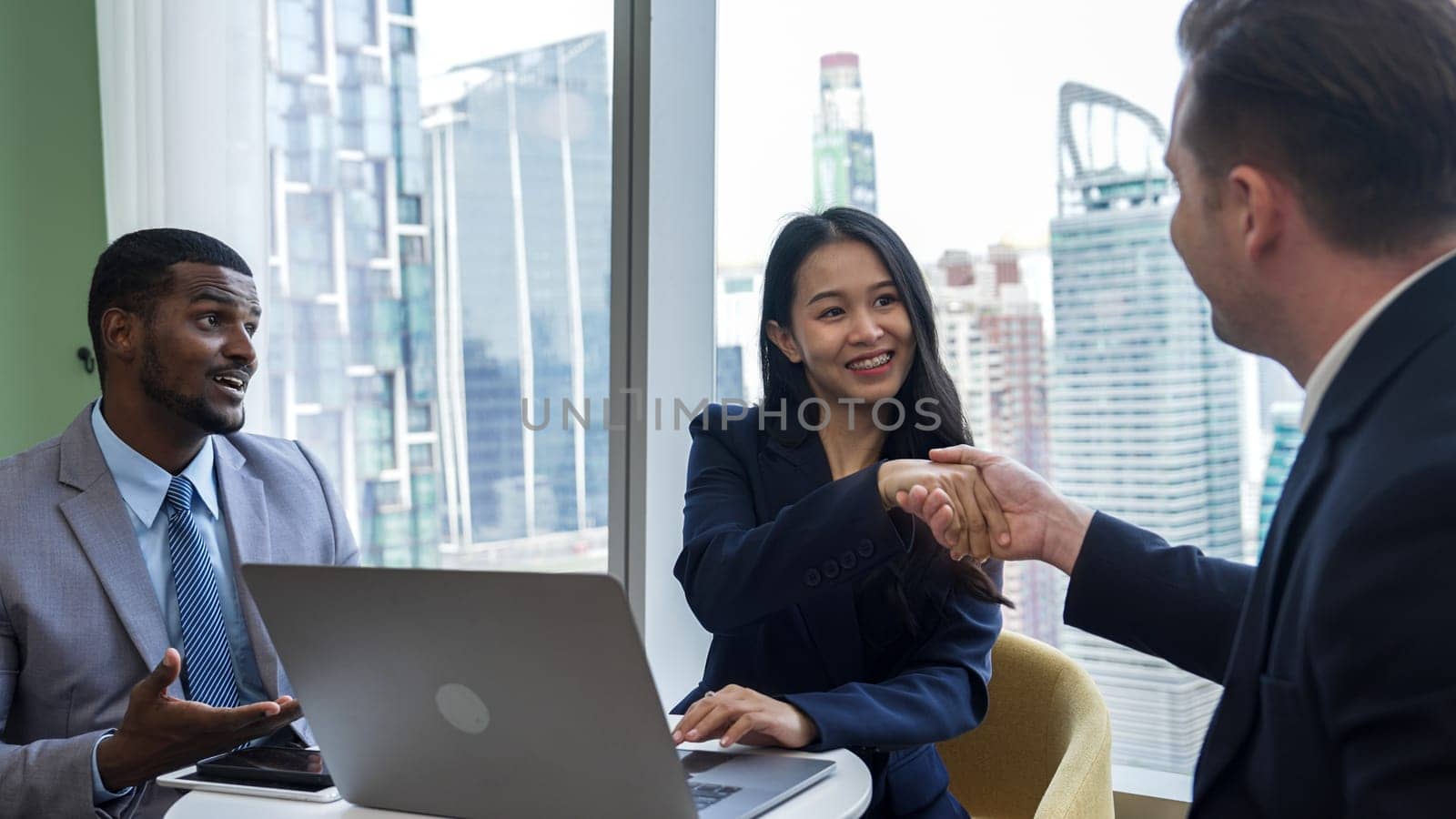 Ornament office with cityscape view, business college or corporate consultant greeting with handshake or shake hand after seal corporate agreement deal for business partnership cooperation