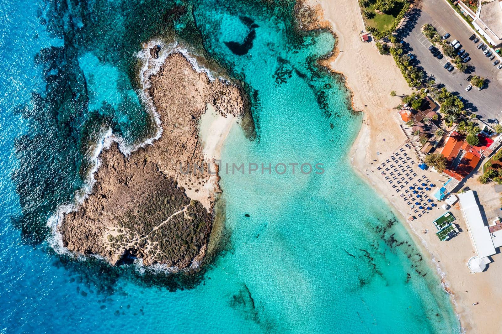 Aerial view of beautiful Nissi beach in Ayia Napa, Cyprus. Nissi beach in Ayia Napa famous tourist beach in Cyprus. A view of a azzure water and Nissi beach in Aiya Napa, Cyprus. by DaLiu