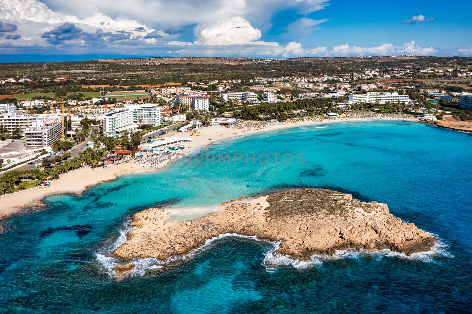 Aerial view of beautiful Nissi beach in Ayia Napa, Cyprus. Nissi beach in Ayia Napa famous tourist beach in Cyprus. A view of a azzure water and Nissi beach in Aiya Napa, Cyprus. by DaLiu