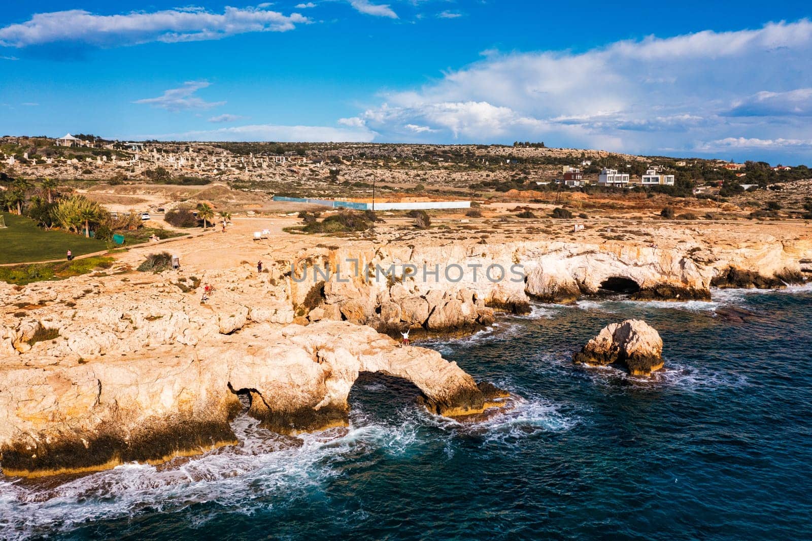 Beautiful bridge of lovers natural rock arch near of Ayia Napa, Cavo Greco and Protaras on Cyprus island, Mediterranean Sea. Legendary bridge lovers. Amazing blue green sea and sunny day by DaLiu