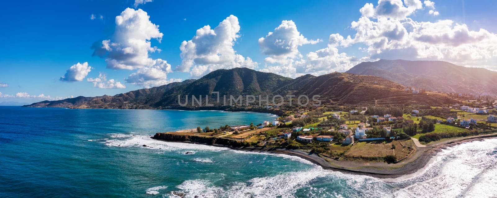 Small local harbor with colorful fishing boats at Pomos,Cyprus. Aerial view of Pomos fishermans harbour in Cyprus. by DaLiu