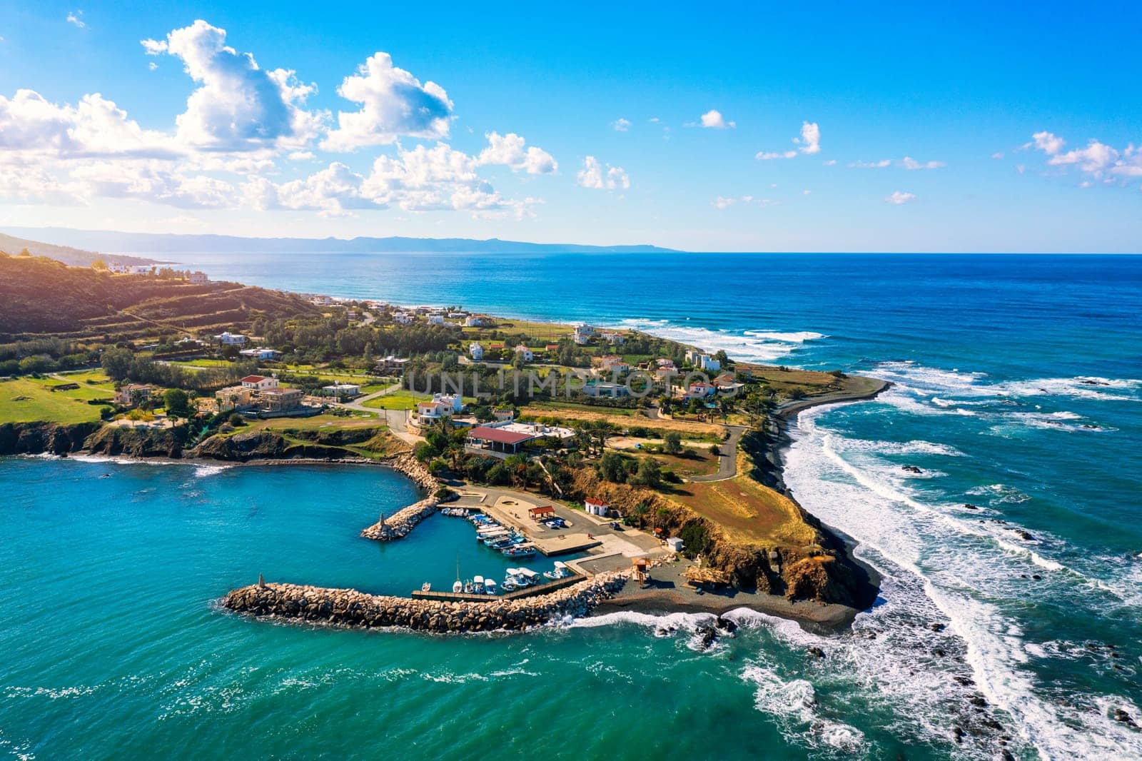 Small local harbor with colorful fishing boats at Pomos,Cyprus. Aerial view of Pomos fishermans harbour in Cyprus.