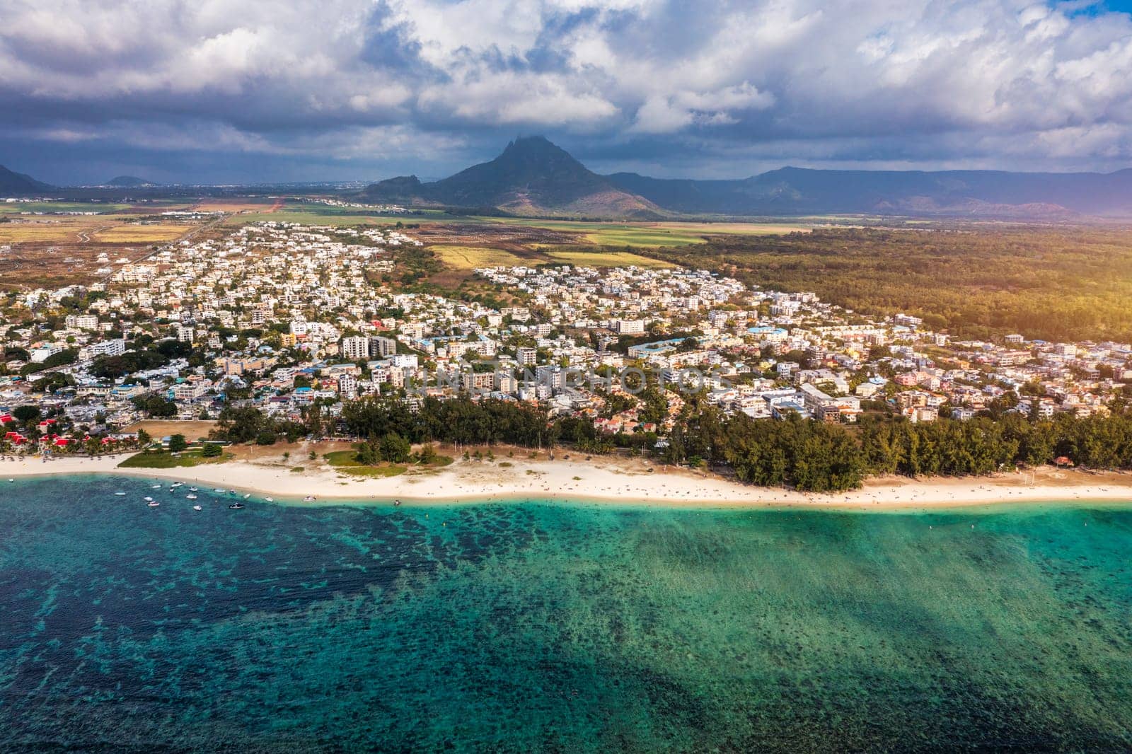 Beach of Flic en Flac with beautiful peaks in the background, Mauritius. Beautiful Mauritius Island with gorgeous beach Flic en Flac, aerial view from drone. Flic en Flac Beach, Mauritius Island. by DaLiu