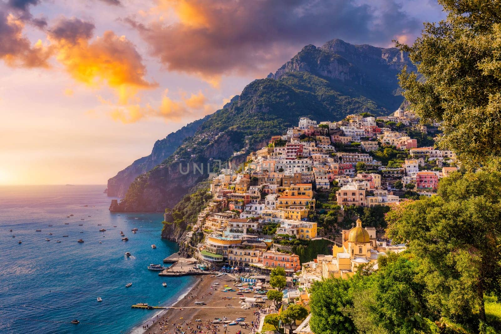 View of Positano with comfortable beach and blue sea on Amalfi Coast in Campania, Italy. Positano village on the Amalfi Coast, Salerno, Campania. Beautiful Positano, Amalfi Coast in Campania.