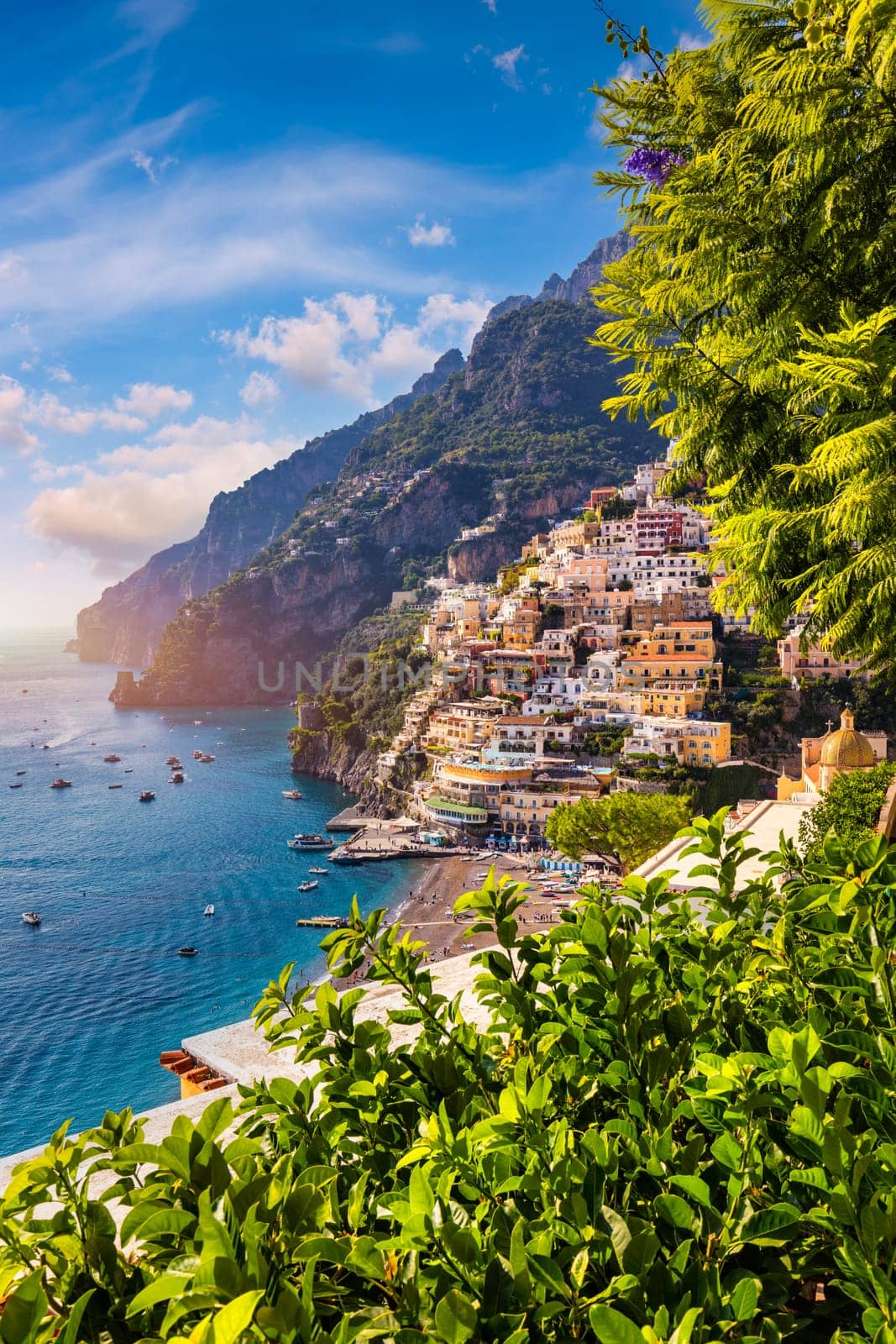 View of Positano with comfortable beach and blue sea on Amalfi Coast in Campania, Italy. Positano village on the Amalfi Coast, Salerno, Campania. Beautiful Positano, Amalfi Coast in Campania.