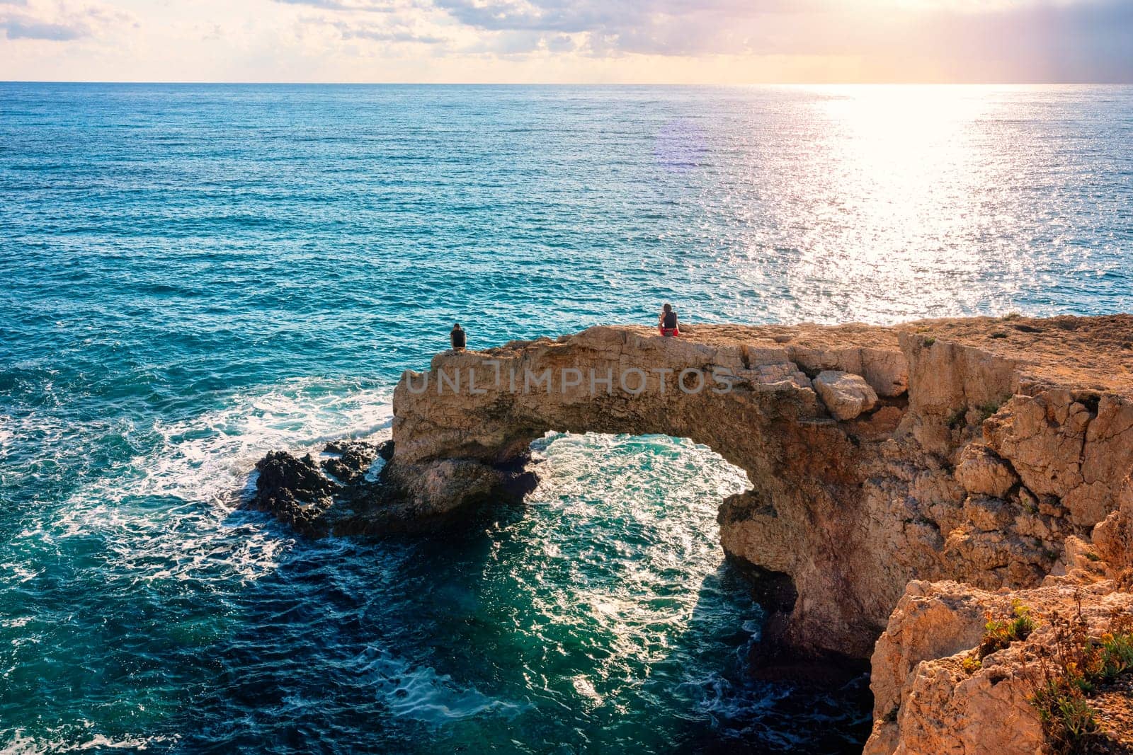 Beautiful bridge of lovers natural rock arch near of Ayia Napa, Cavo Greco and Protaras on Cyprus island, Mediterranean Sea. Legendary bridge lovers. Amazing blue green sea and sunny day by DaLiu