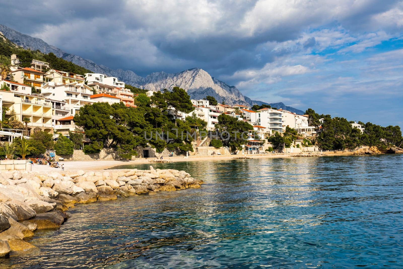 Beautiful Brela on Makarska riviera, Croatia. Adriatic Sea with amazing turquoise clean water and white sand. Aerial view of Brela town and waterfront on Makarska riviera, Dalmatia region of Croatia.