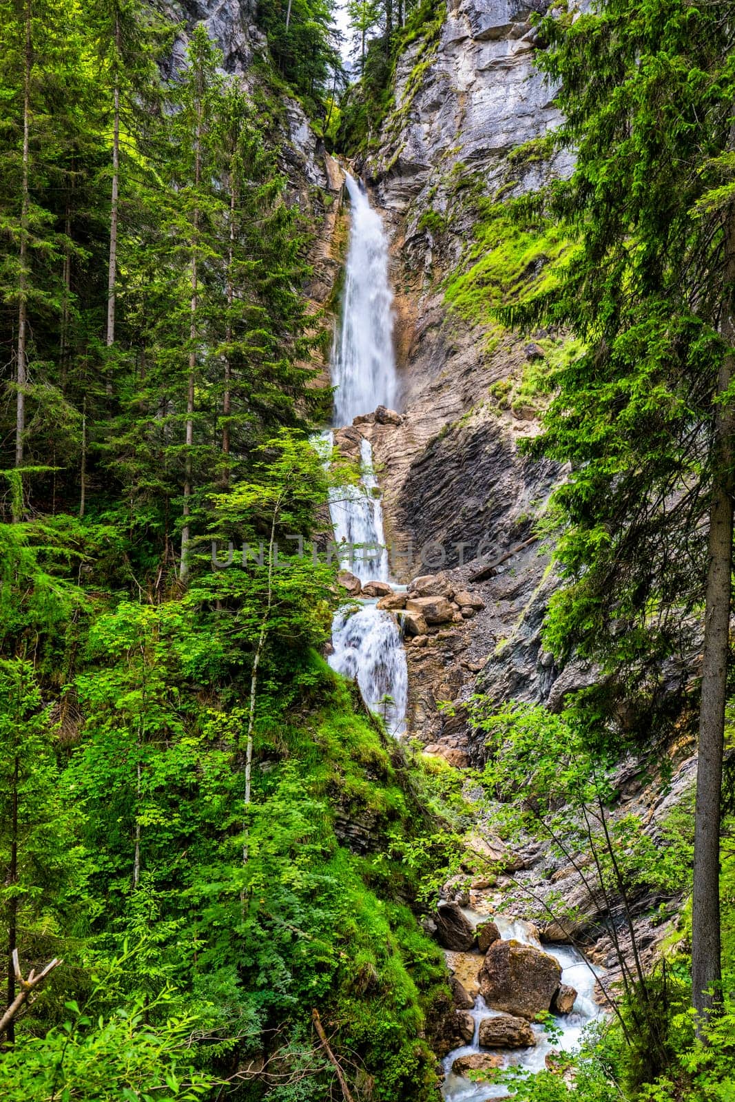 The beautiful three-part Lower Martuljek Waterfall in the Julian Alps, Slovenia. Triglav National Park. Scenic mountain with Martuljek waterfall in Triglav national park in Julian Alps, Slovenia. by DaLiu