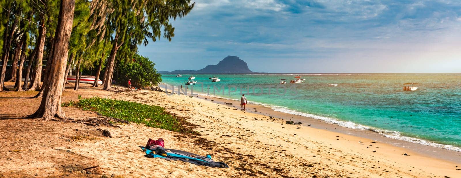 Beach of Flic en Flac with beautiful peaks in the background, Mauritius. Beautiful Mauritius Island with gorgeous beach Flic en Flac. Flic en Flac Beach, Mauritius Island.
