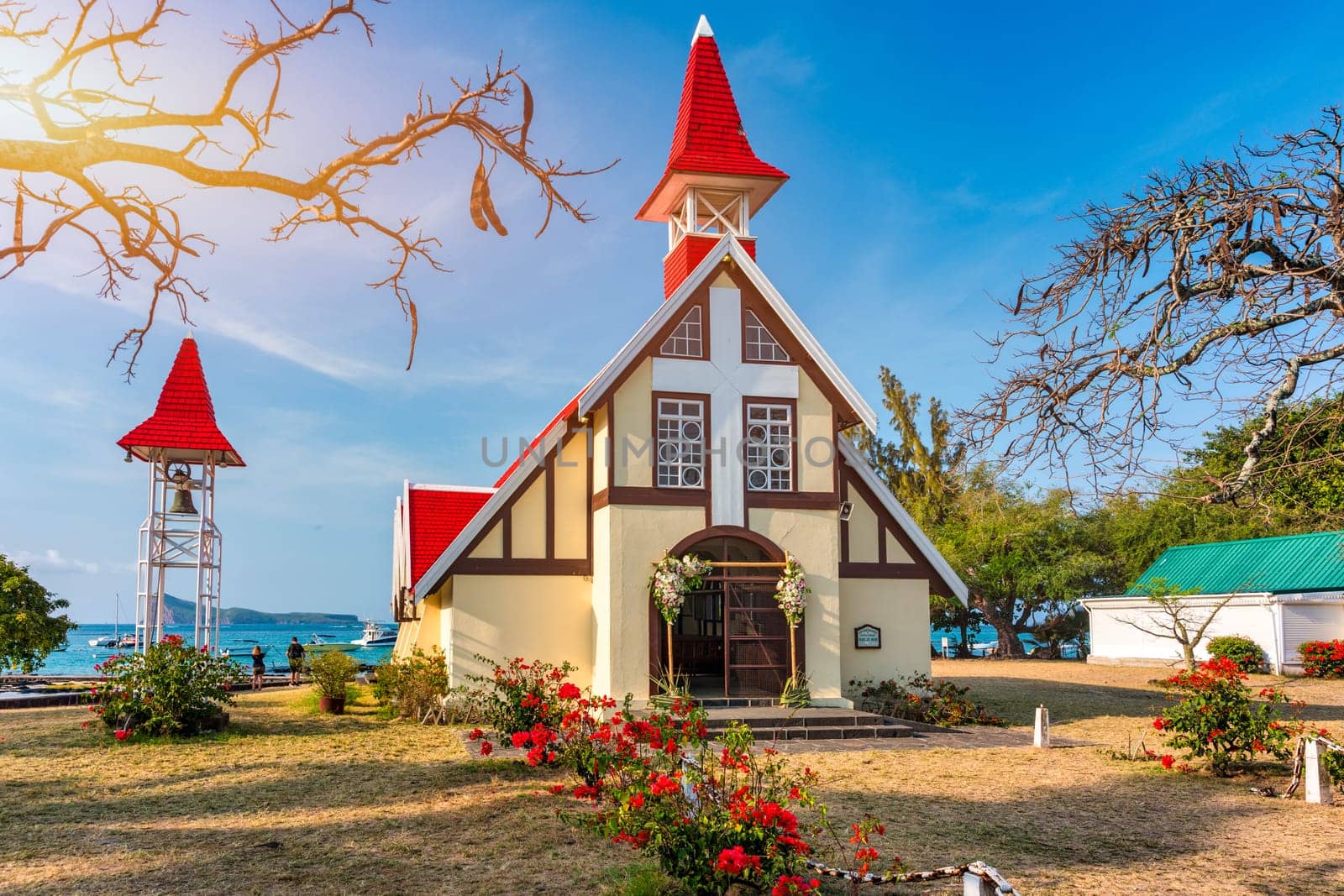 Red church at Cap Malheureux village, Mauritius Island. Notre Dame de Auxiliatrice, rural church with red roof in Cap Malheureux tropical village on Mauritius island, Indian Ocean.