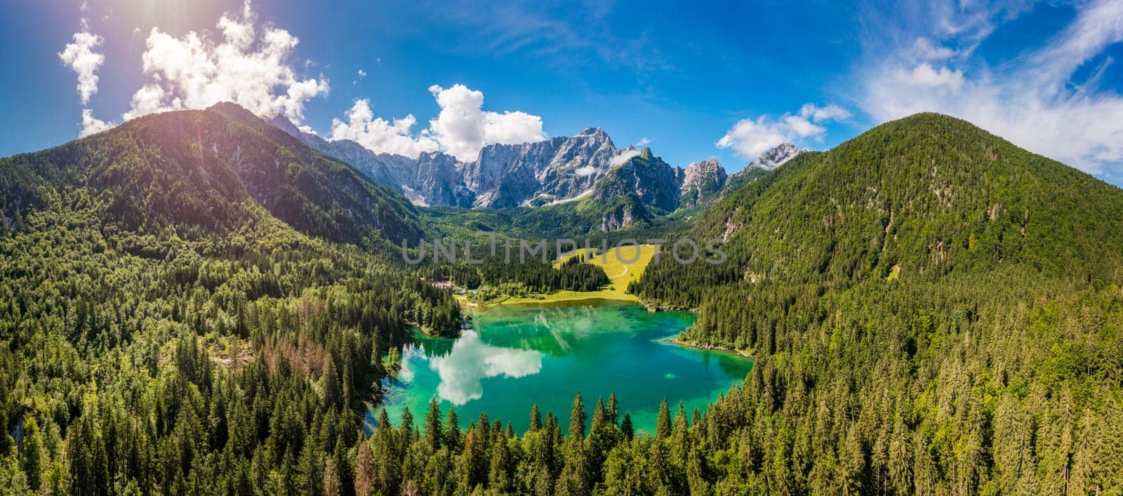 Lake of Fusine (Lago Superiore di Fusine) and the Mountain Range of Mount Mangart, Julian Alps, Tarvisio, Udine province, Friuli Venezia Giulia, Italy, Europe. Picturesque lake Lago Fusine in Italy. by DaLiu