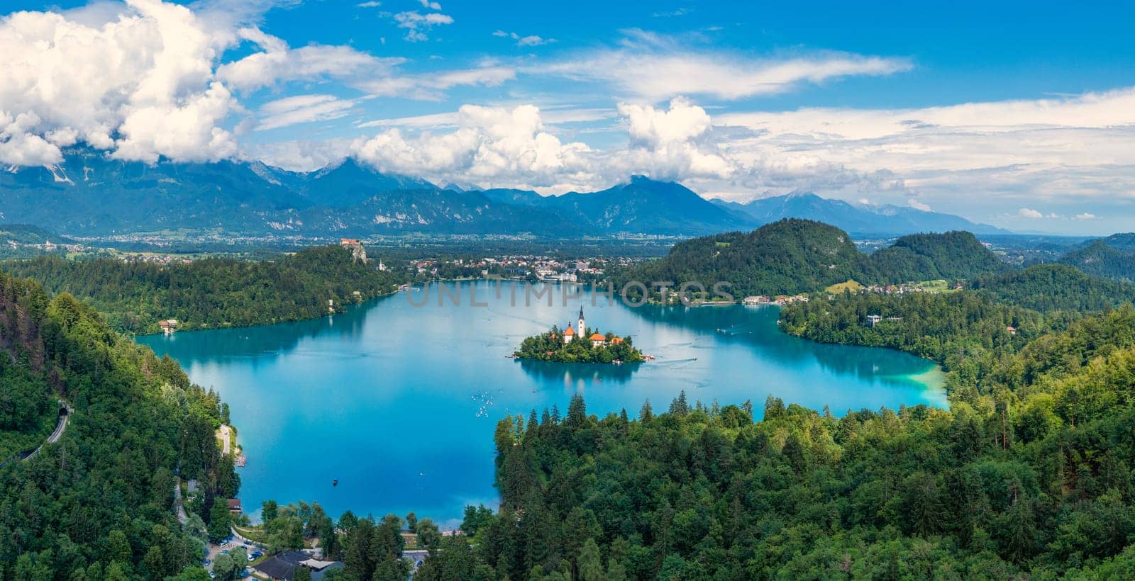 Lake Bled in Slovenia. Beautiful mountains and Bled lake with small Pilgrimage Church. Bled lake and island with Pilgrimage Church of the Assumption of Maria. Bled, Slovenia, Europe. by DaLiu