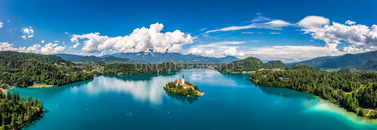 Lake Bled in Slovenia. Beautiful mountains and Bled lake with small Pilgrimage Church. Bled lake and island with Pilgrimage Church of the Assumption of Maria. Bled, Slovenia, Europe.