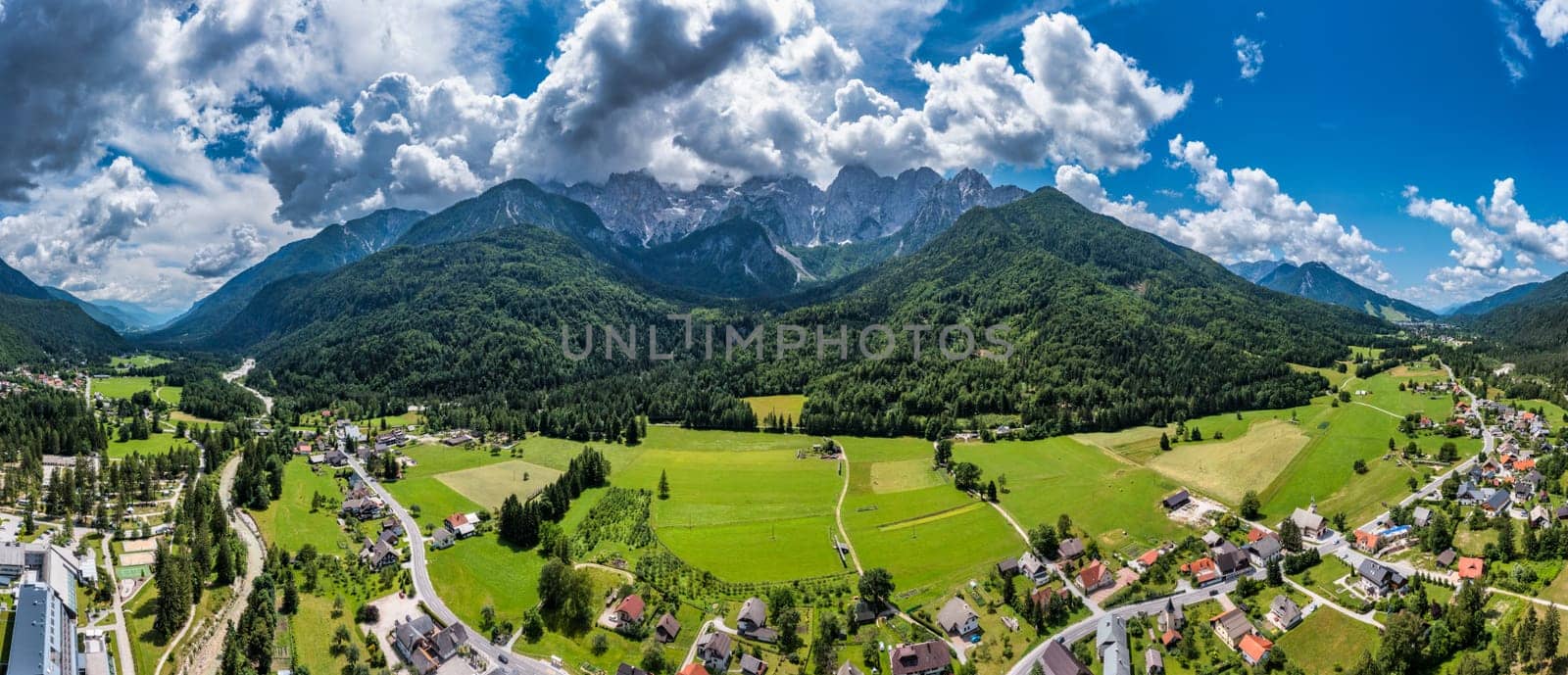 Gozd Martuljek town in Slovenia at summer with beautiful nature and mountains in the background. View of mountain landscape next to Gozd Martuljek in Slovenia, view from the top of Gozd Martuljek. by DaLiu