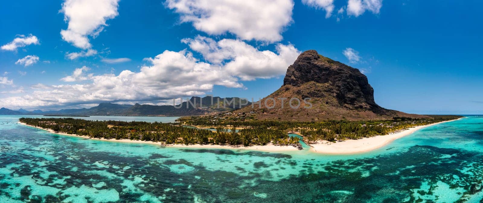 Aerial view of Le morne Brabant in Mauriutius. Tropical crystal ocean with Le Morne mountain and luxury beach in Mauritius. Le Morne beach with palm trees, white sand and luxury resorts, Mauritius.