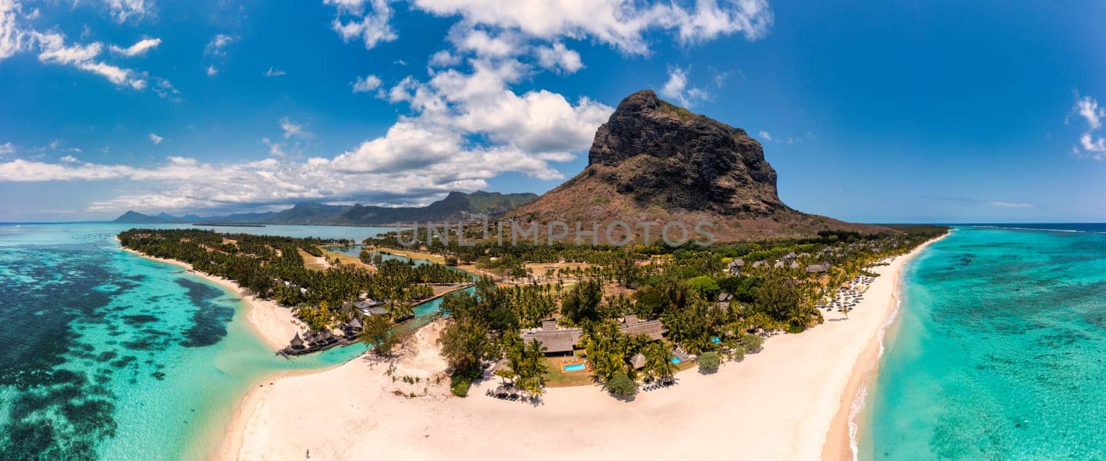 Beach with palm trees and umbrellas on Le morne beach in Mauriutius. Luxury tropical beach and Le Morne mountain in Mauritius. Le Morne beach with palm trees, white sand and luxury resorts, Mauritius by DaLiu